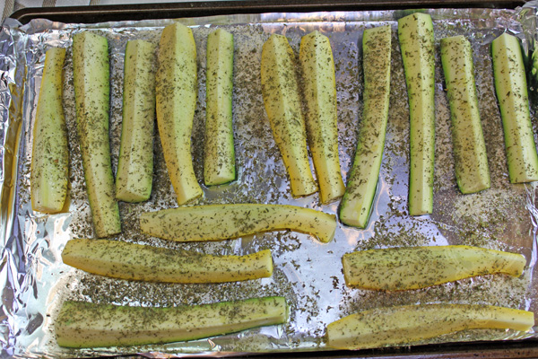 Squash and Zucchini Spears with oil and seasonings, ready for the oven.