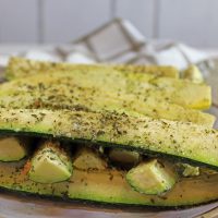 Baked Squash and Zucchini Spears piled on a plate.