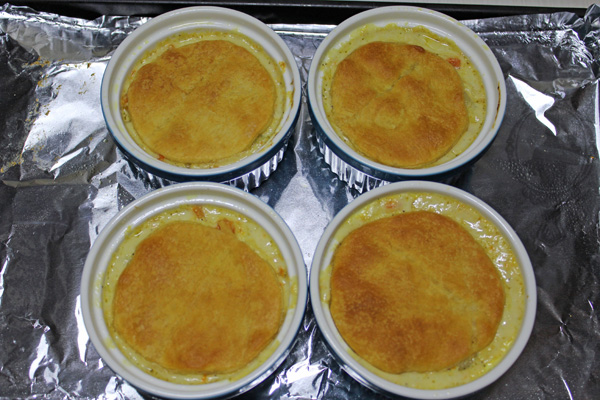 Individual chicken pot pies fresh out of the oven.