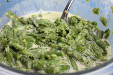 Close up of a bowl full of Cheesy Green Beans.