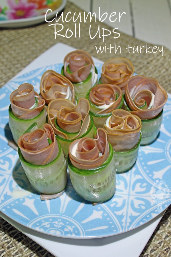 Cucumber Roll Ups on a blue plate.