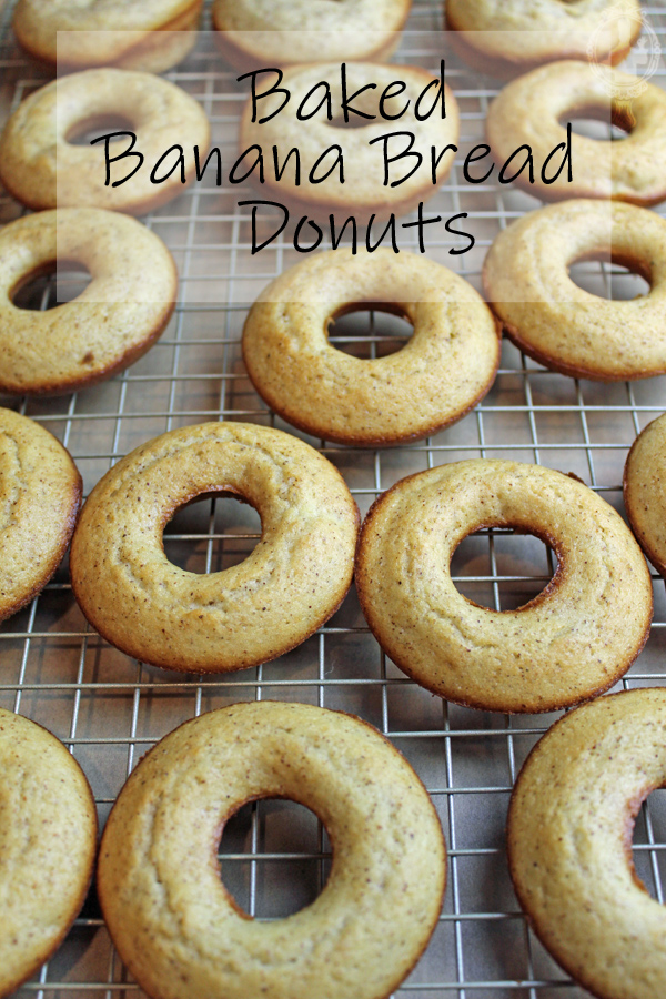 Plain (un-iced) banana bread donuts on a rack.