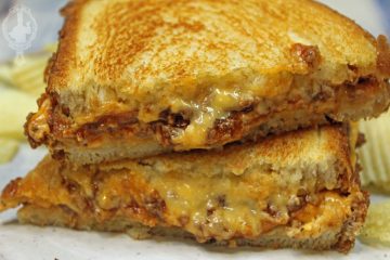 Close up of two halves of Sloppy Joe Grilled Cheese