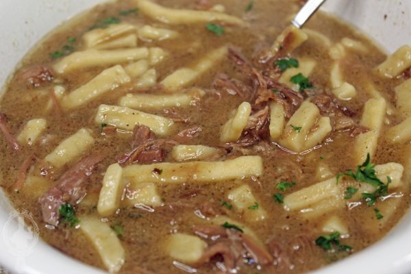 Close up of a bowl of Beef and Noodle Soup.