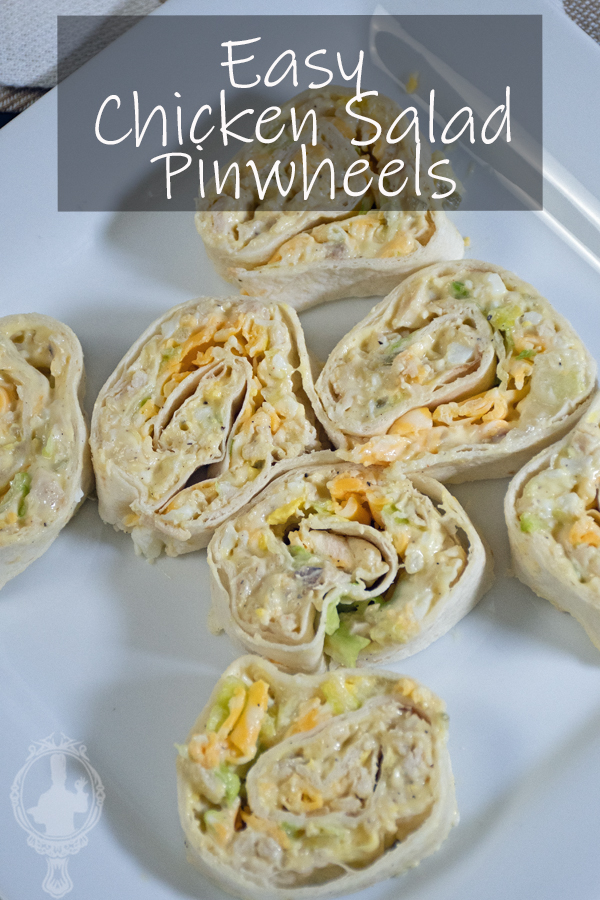 Overhead view of sliced chicken salad pinwheels on a plate.