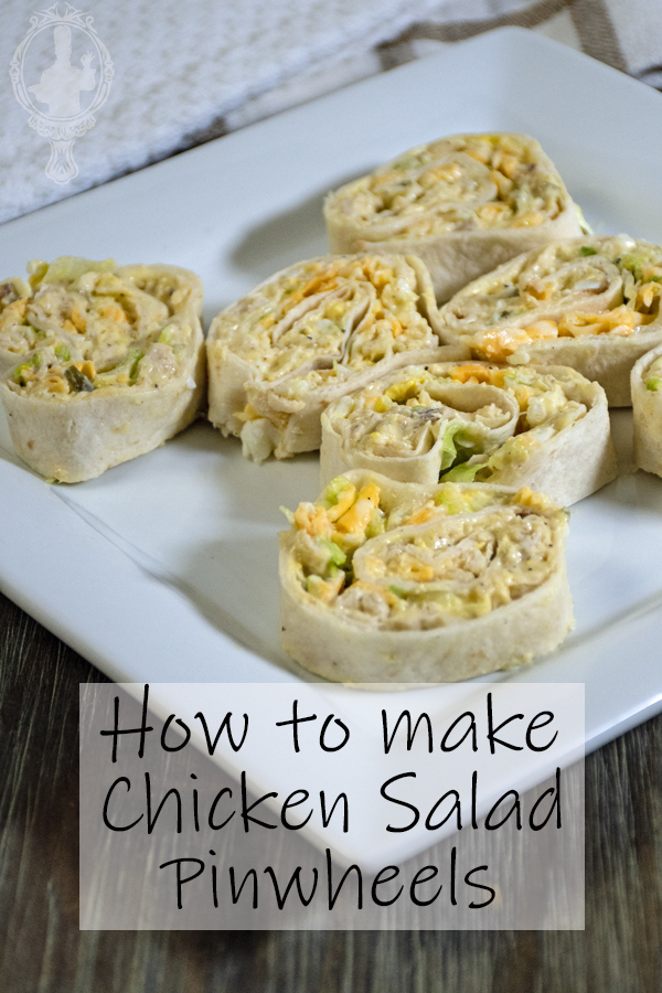 Sliced chicken salad pinwheels on a plate.