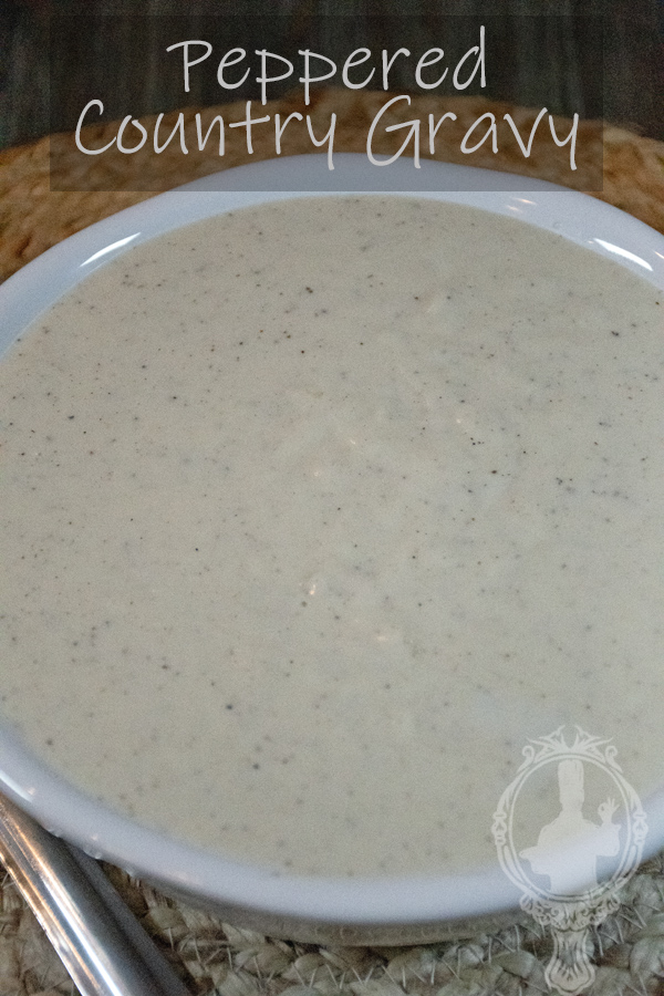Close up of a serving bowl of country gravy.