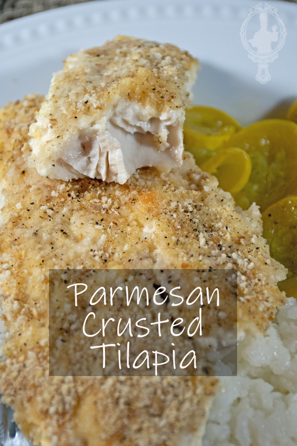 A bite sitting on top of the Parmesan Crusted Tilapia.