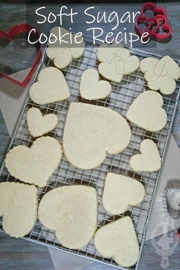 Overhead view of soft sugar cookies on a cooling rack.