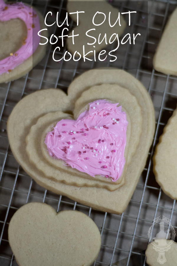 Overhead view of 3 heart cookies stacked on each other. The top one is frosted.