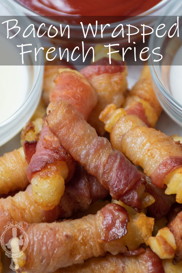 Close up of a serving of bacon fries with condiments on the side.