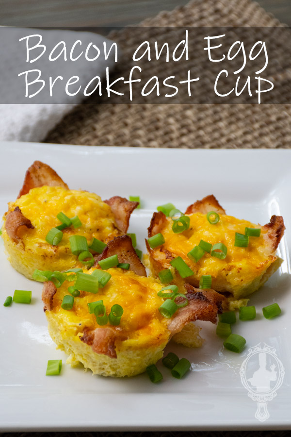 Three breakfast cups on a plate with green onions sprinkled on top.