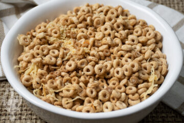 Close up of a serving bowl full of Cheerios Snack Mix.