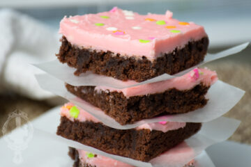 A stack of chocolate covered brownies.