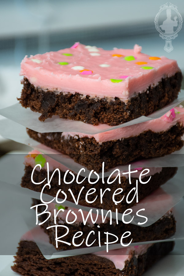 A stack of chocolate covered brownies.
