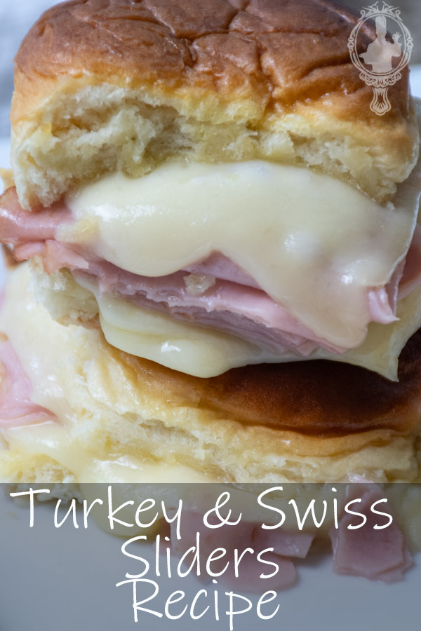 Close up of two turkey and swiss sliders stacked on each other.